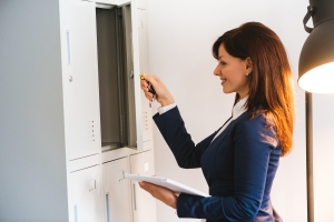 Image of a women smiling and opening a locker